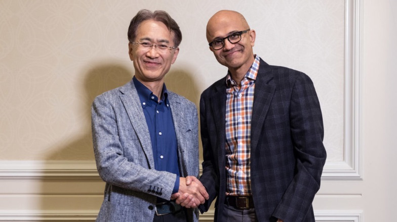 Sony and Microsoft executives shaking hands